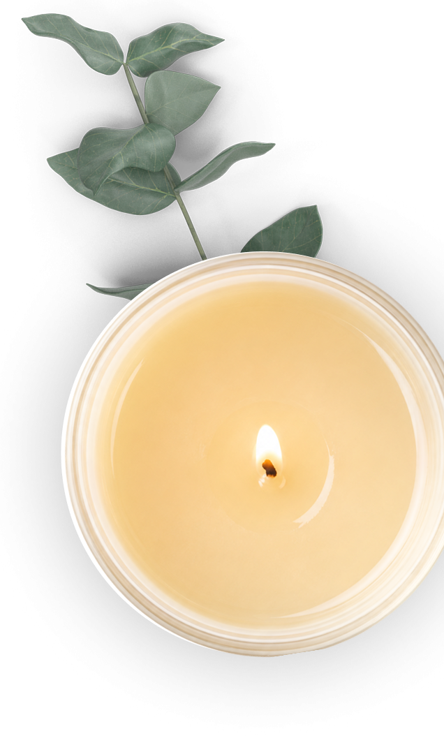 A single candle lit in a white bowl, casting a shadow on a white surface.